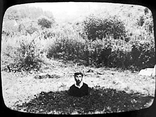 Keith Arnatt, from Self-Burial in 9 photographs, courtesy MediaArtNet.org